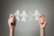 hands holding paper cutout family chain